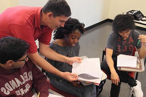 Professor working closely with students